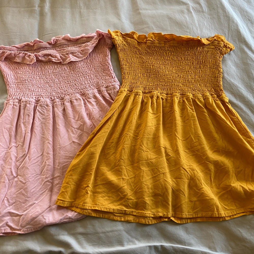 Tube tops. Tight at the top and loose at the bottom. Pink and yellow